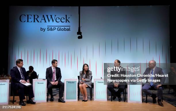 Michael Pickens, Principal Research Analyst of S&P Global, from left, moderates a panel session by Daniel Wesson, executive vice president & CEO of...