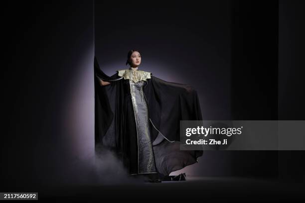 Model walks the runway at the Guanjuji collection show by designers Yazheng Guan during day five of China Fashion Week A/W 2024 on March 27, 2024 in...