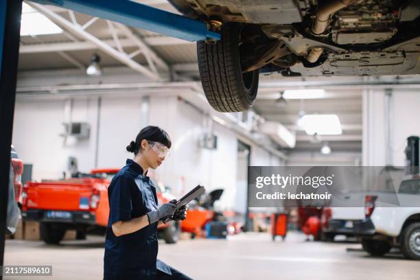 completing the car emissions test - oil change stock pictures, royalty-free photos & images
