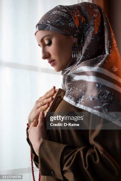 muslim woman praying at home - white bead stock pictures, royalty-free photos & images