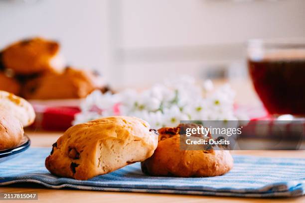 close-up coffee and tasty cookies with raisins and walnuts on the plate - raisin cookie stock pictures, royalty-free photos & images