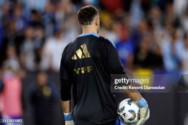 Goalkeeper Emiliano Martínez of Argentina warms up before a friendly soccer match against Costa Rica at United Airlines Field at the Los Angeles...