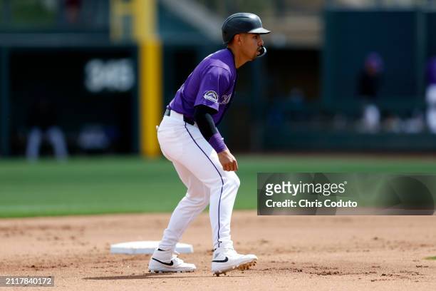 Alan Trejo of the Colorado Rockies leads off second base during a spring training game against the Milwaukee Brewers at Salt River Fields at Talking...