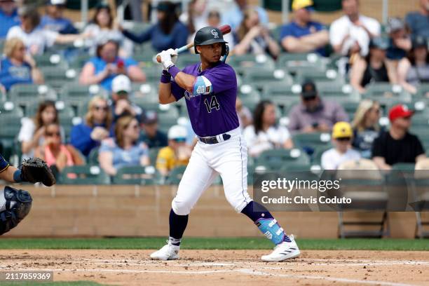 Ezequiel Tovar of the Colorado Rockies bats during a spring training game against the Milwaukee Brewers at Salt River Fields at Talking Stick on...