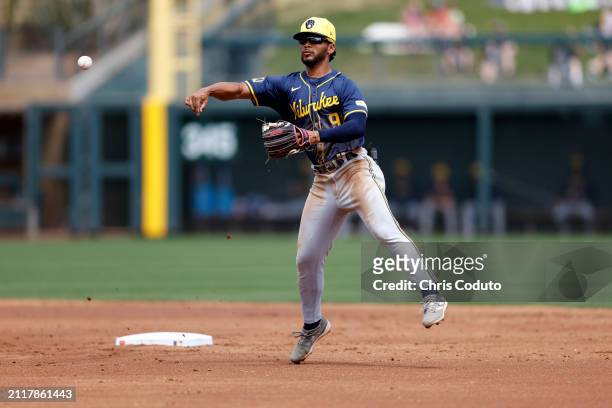 Eric Brown Jr. #91 of the Milwaukee Brewers turns a double play during a spring training game against the Colorado Rockies at Salt River Fields at...