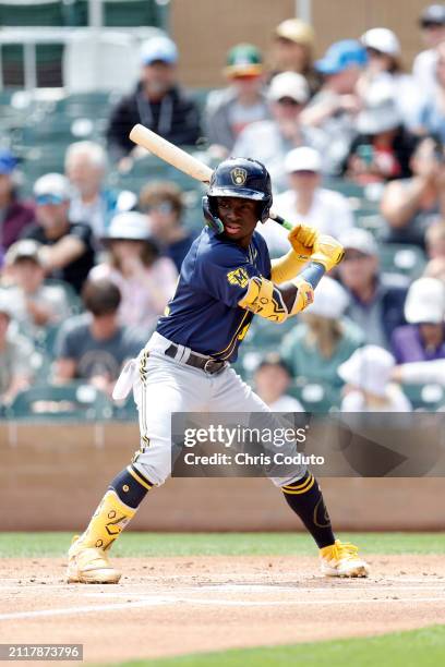 Luis Lara of the Milwaukee Brewers bats during a spring training game against the Colorado Rockies at Salt River Fields at Talking Stick on March 26,...