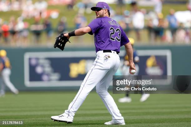 Kris Bryant of the Colorado Rockies warms up before a spring training game against the Milwaukee Brewers at Salt River Fields at Talking Stick on...