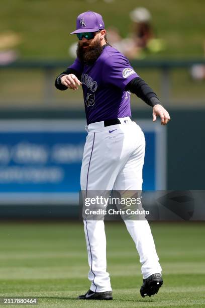 Charlie Blackmon of the Colorado Rockies prepares for a spring training game against the Milwaukee Brewers at Salt River Fields at Talking Stick on...