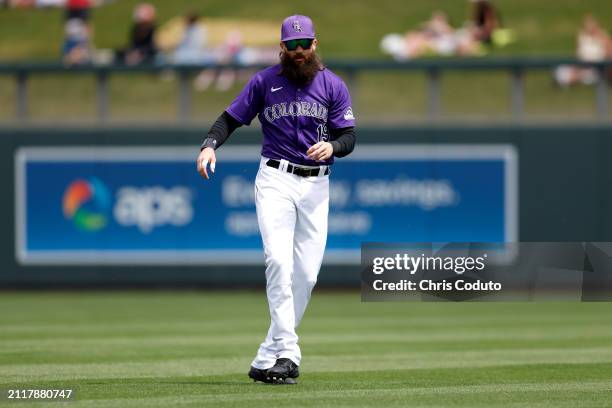 Charlie Blackmon of the Colorado Rockies prepares for a spring training game against the Milwaukee Brewers at Salt River Fields at Talking Stick on...