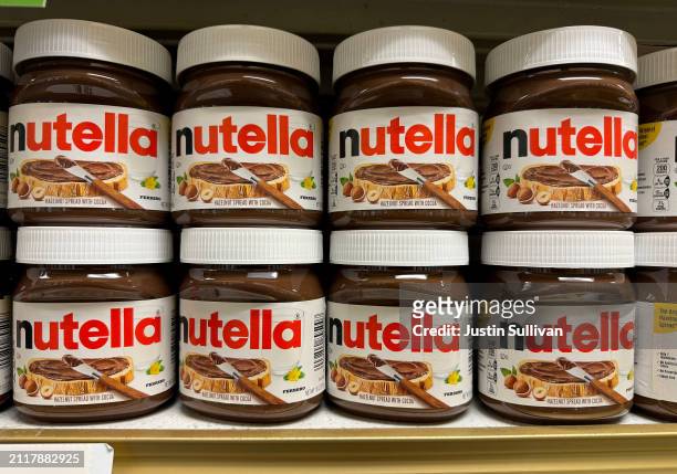 Containers of Nutella hazelnut spread made by the Ferrero company are displayed on a shelf at a grocery store on March 27, 2024 in San Anselmo,...