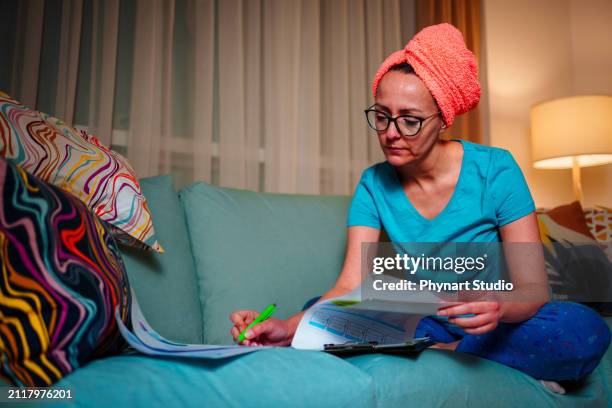 working late from his home office - nightwear stock pictures, royalty-free photos & images