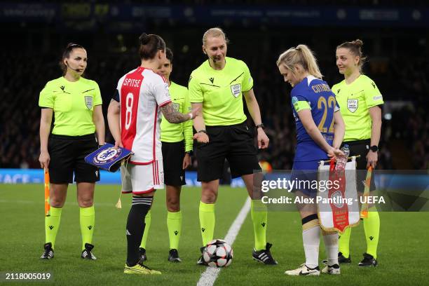 Captain's Sherida Spitse of Ajax and Erin Cuthbert of Chelsea join Referee Tess Olofsson for the coin toss prior to kick-off ahead of the UEFA...