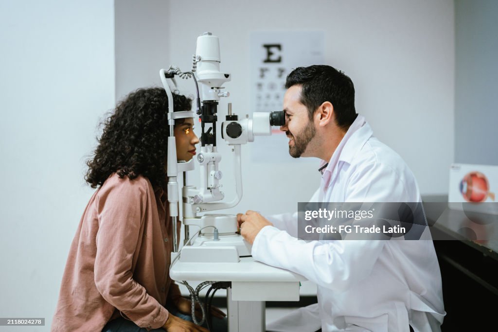Young woman doing optical exam at medical clinic