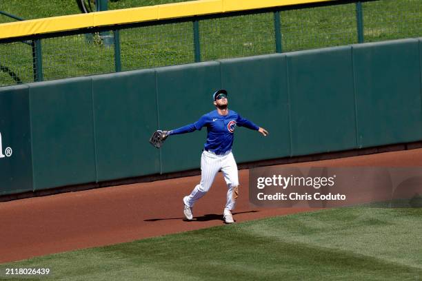 Cody Bellinger of the Chicago Cubs fields a fly ball during a spring training game against the St. Louis Cardinals /at Sloan Park on March 25, 2024...