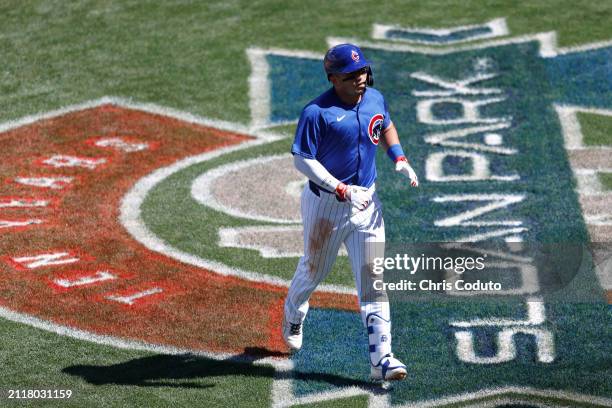 Seiya Suzuki of the Chicago Cubs reacts after hitting a solo home run during the fifth inning of a spring training game against the St. Louis...