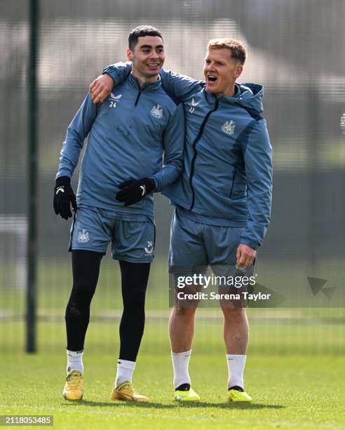 Matt Ritchie puts his arms around Miguel Almirón during the Newcastle United Training Session at the Newcastle United Training Centre on March 27,...