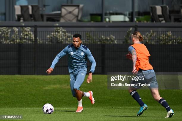Jacob Murphy runs with the ball during the Newcastle United Training Session at the Newcastle United Training Centre on March 27, 2024 in Newcastle...