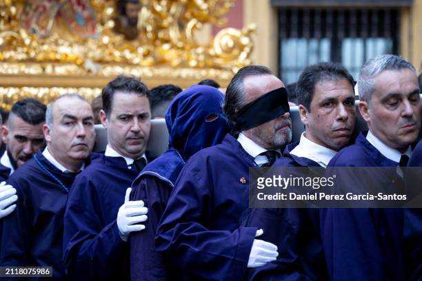 Penitents take part in the Rico brotherhood procession during Holy Week on March 27, 2024 in Malaga, Spain. Holy Week, known locally as Semana Santa,...