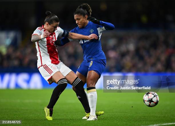 Catarina Macario of Chelsea is challenged by Sherida Spitse of Ajax during the UEFA Women's Champions League 2023/24 Quarter Final Leg Two match...