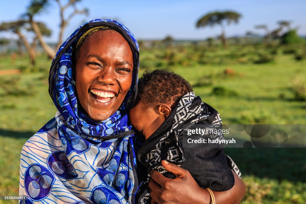 Woman from Borana tribe holding her baby, Ethiopia, Africa
