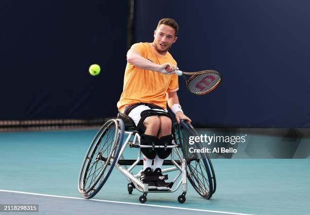 Alfie Hewett of Great Britain returns a shot against Shingo Kunieda of Japan during their match on Day 12 of the Miami Open at Hard Rock Stadium on...