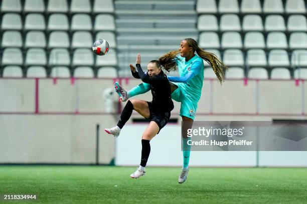 Lou BOGAERT of Paris FC and Maelys MPOME of Montpellier during the D1 Arkema match between Paris FC and Montpellier at Stade Charlety on March 29,...