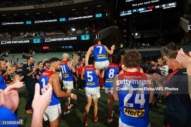 Jack Viney of the Demons celebrates his 250th game during the 2024 AFL Round 03 match between the Port Adelaide Power and the Melbourne Demons at...