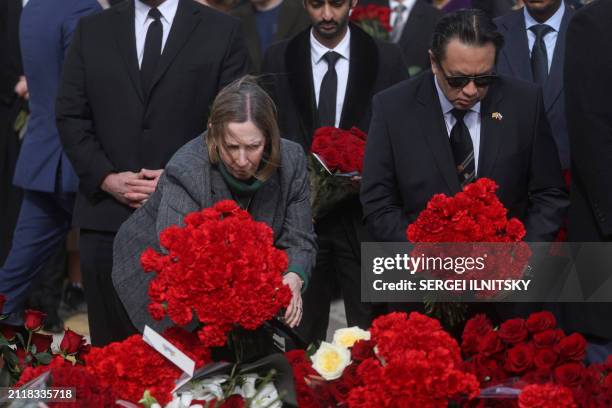 Ambassador to Russia, Lynne Tracy lays a bouquet of flowers during a flower laying ceremony along with ambassadors of foreign diplomatic missions at...