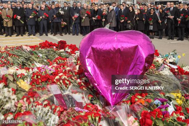 Ambassadors and representatives of diplomatic missions accredited in Russia stand at attention as they attend a flower laying ceremony at the...