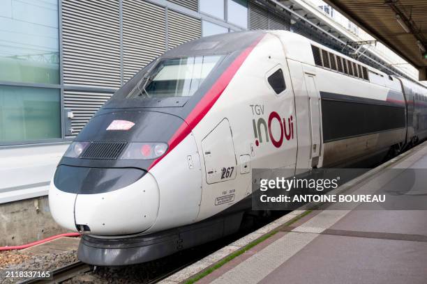 High-speed train called TGV Inoui seen from the platform of Part-Dieu station in Lyon, France on 21 February 2024.