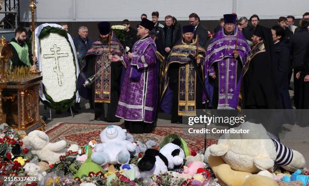 Russian Orhodox priests pray for the victims near the Crocus City Hall on March 30, 2024 in Krasnogorsk, Russia. On March 22, the nearby Crocus City...