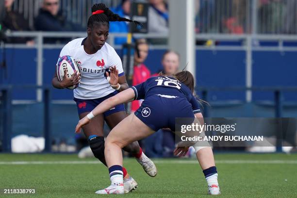 France's centre Nassira Konde challenges Scotland's fly-half Helen Nelson during the Six Nations international women's rugby union match between...