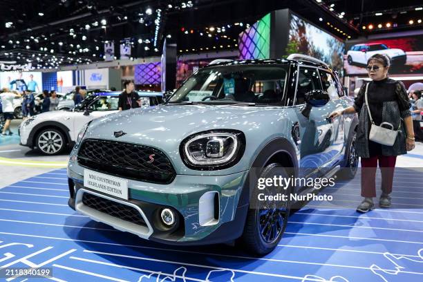 Visitor is inspecting the MINI Cooper Countryman Highlands Edition car on display at the 45th Bangkok International Motor Show in Nonthaburi...