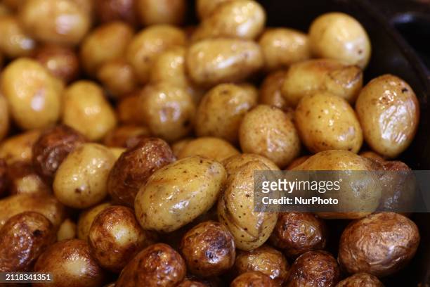 Baked potatoes are seen at the Easter market in Krakow, Poland on March 30, 2024.
