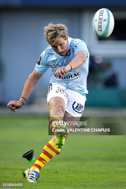 Perpignan's Australian fly-half Jake Mcintyre kicks the ball to convert a point during the French Top14 rugby union match between USA Perpignan and...