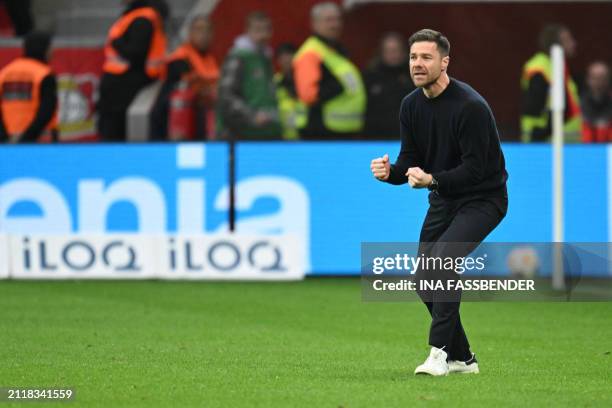 Bayer Leverkusen's Spanish head coach Xabi Alonso celebrates his team's 2-1 goal during the German first division Bundesliga football match Bayer 04...