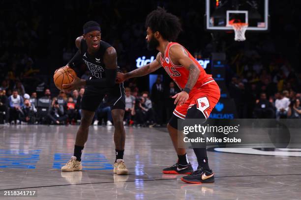 Dennis Schroder of the Brooklyn Nets in action against Coby White of the Chicago Bulls at Barclays Center on March 29, 2024 in New York City. NOTE TO...