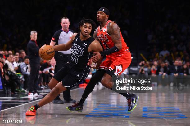 Cam Thomas of the Brooklyn Nets in action against Torrey Craig of the Chicago Bulls at Barclays Center on March 29, 2024 in New York City. NOTE TO...