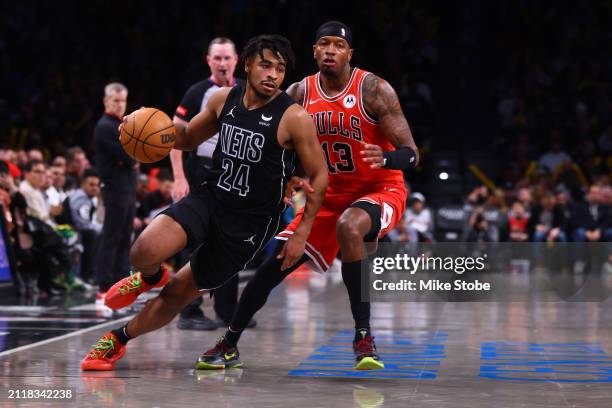Cam Thomas of the Brooklyn Nets in action against Torrey Craig of the Chicago Bulls at Barclays Center on March 29, 2024 in New York City. NOTE TO...