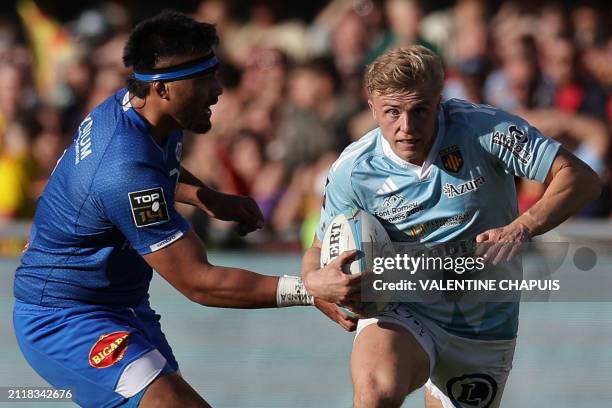 Perpignan's English wing Alistar Crossdale runs with the ball during the French Top14 rugby union match between USA Perpignan and Castres Olympique...