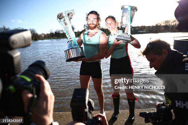 Cambridge University women's team president Jenna Armstrong and men's team president Sebastian Benzecry pose with their trophies after winning the...