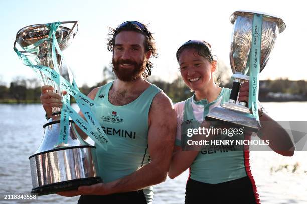 Cambridge University women's team president Jenna Armstrong and men's team president Sebastian Benzecry pose with their trophies after winning the...