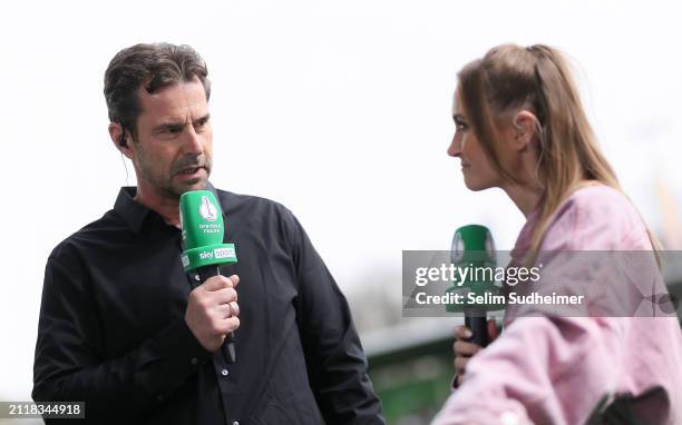 Sports Director Ralf Kellermann of Wolfsburg is interviewed by host Nele Schenker prior to the Women's DFB Cup semifinal match between VfL Wolfsburg...