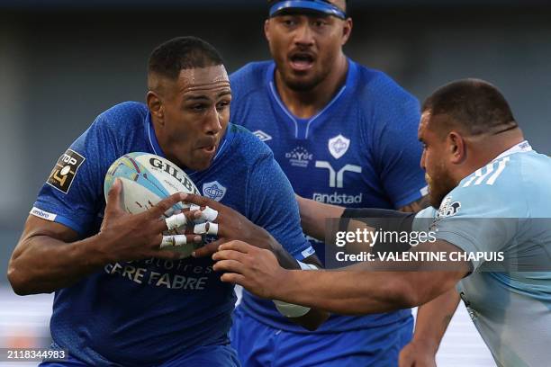 Castres' French flanker Mathieu Babillot is tackled during the French Top14 rugby union match between USA Perpignan and Castres Olympique at the...