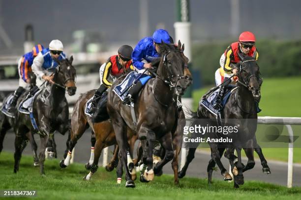 Riders compete to qualify in the 2.410m main race within the 2024 Dubai World Cup at Meydan Racecourse in Dubai, United Arab Emirates on March 30,...