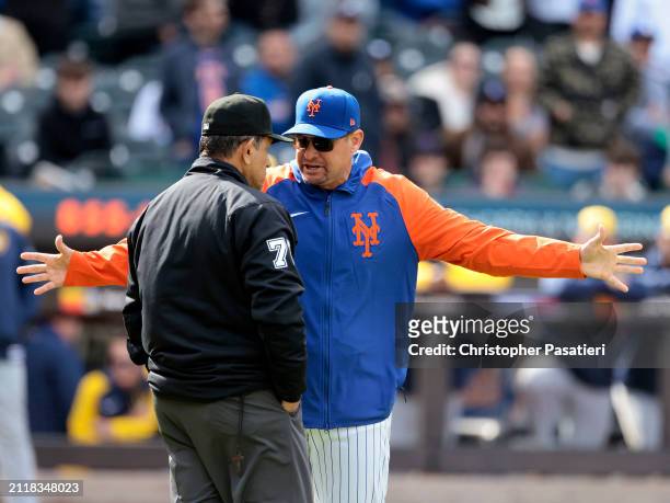 Manager Carlos Mendoza of the New York Mets argues with umpire Alfonso Marquez after pitcher Yohan Ramírez of the New York Mets was ejected for...