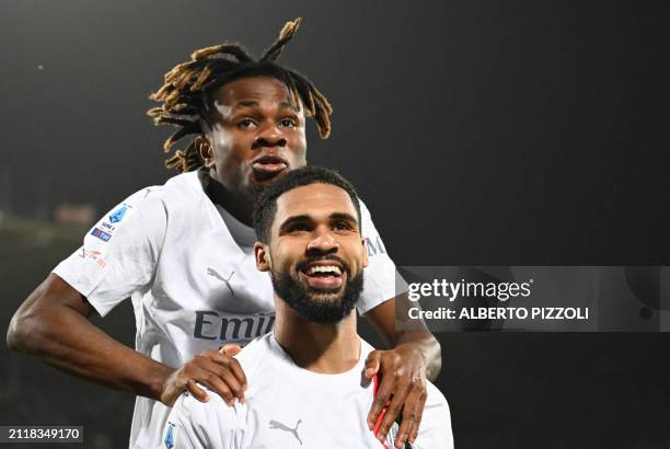 Milan's English midfielder Ruben Loftus-Cheek celebrates scoring AC Milan's first goal with AC Milan's Nigerian midfielder Samuel Chukwueze during...