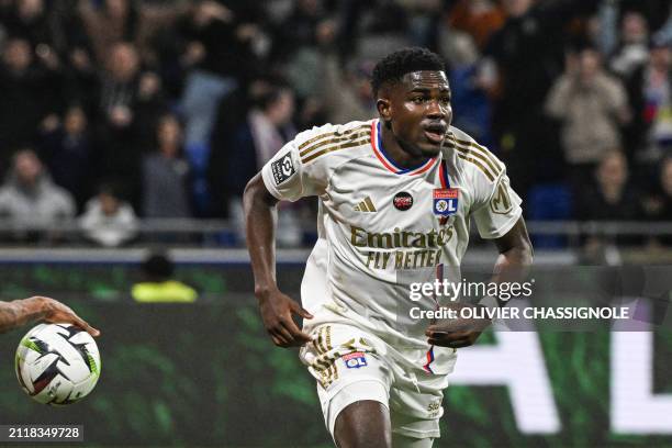 Lyon's Ghanaian forward Ernest Nuamah celebrates after scoring his team's first goal during the French L1 football match between Olympique Lyonnais...