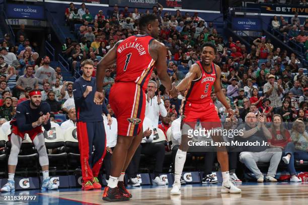Zion Williamson of the New Orleans Pelicans celebrates during the game with Herb Jones against the Boston Celtics on March 30, 2024 at the Smoothie...