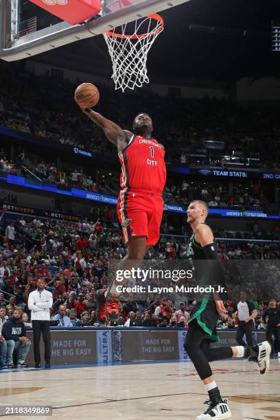 Zion Williamson of the New Orleans Pelicans dunks the ball during the game against the Boston Celtics on March 30, 2024 at the Smoothie King Center...